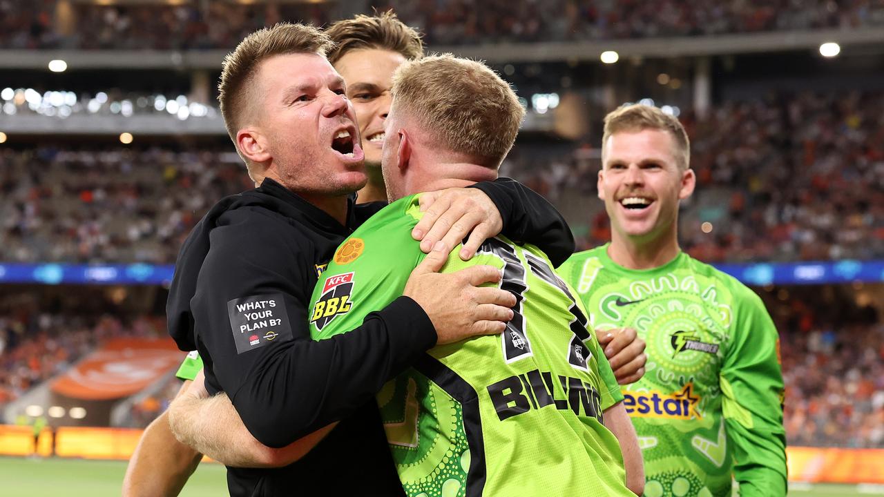 David Warner grabs Sam Billings after a big BBL win in Perth. Picture: Paul Kane/Getty Images