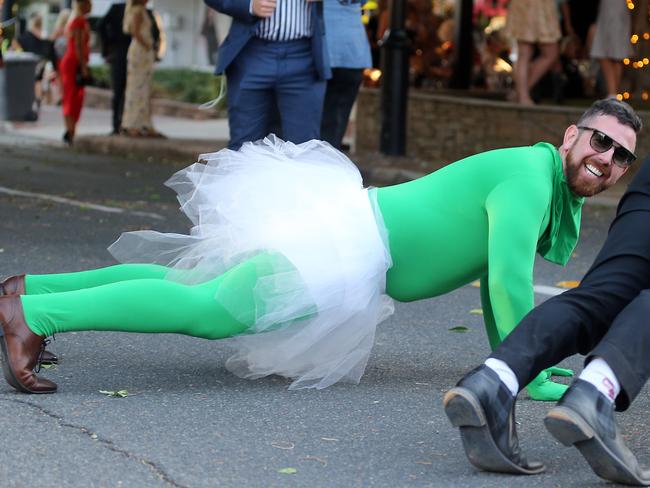 People leaving the Melbourne Cup Day at Eagle Farm. Picture: AAP/Richard Gosling