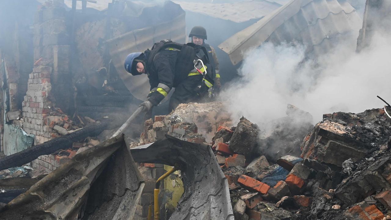 Emergency workers respond to the site of a destroyed house after one of the Russian drone strikes in Kharkiv. Picture: Sergey Bobok/AFP