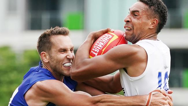 Aiden Bonar is tackled by Jamie Macmillan. Picture: AAP Image/Michael Dodge