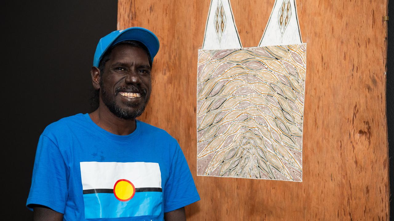 Telstra National Aboriginal and Torres Strait Islander Art Awards winner and Yolngu man Wurrandan Marawili standing next to his bark painting 'Rumbal, the body/the truth' at the Museum and Art Gallery of the Northern Territory (MAGNT) in Darwin. Picture: Pema Tamang Pakhrin