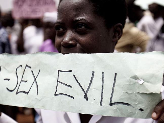 Photo taken on February 14, 2010 shows Ugandans taking part in an anti-gay demonstrationy at Jinja, Kampala. A Ugandan pastor seeking to bolster Uganda's anti-gay laws which already make homosexuality punishable by life imprisonment screened gay porn in a packed Kampala church Wednesday February 17, 2010 in a bid to drum up support that was attended by around 300 supporters after plans for a "million-man march" were thwarted by police. AFP PHOTO/TREVOR SNAPP