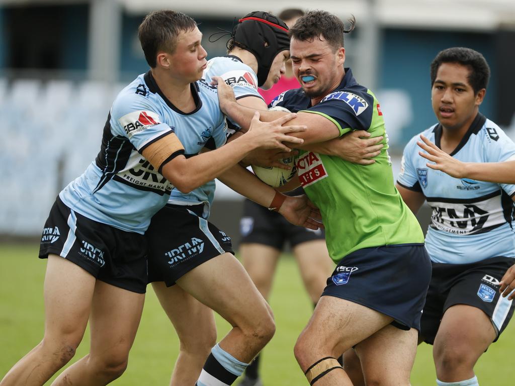 The Sharks and the Raiders were locked in an arm wrestle in the wet conditions at PointsBet Stadium. Picture: Tim Hunter.