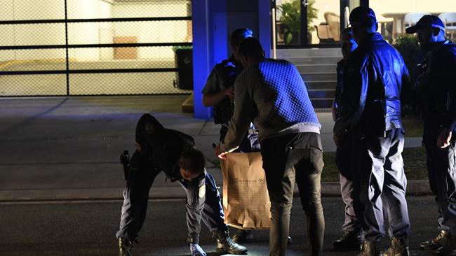 Police gather evidence outside McDonald’s at Warriewood. Picture: Gordon McComiskie