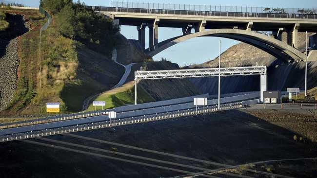 POLL OF TOLL: A toll point and signs for toll payment provider Linkt under construction on the Toowoomba Second Range Crossing. Picture: Kevin Farmer