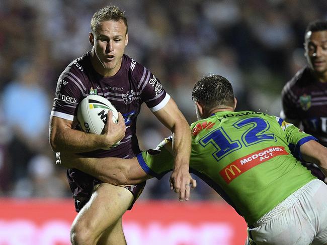 Daly Cherry-Evans is tackled by Elliott Whitehead.