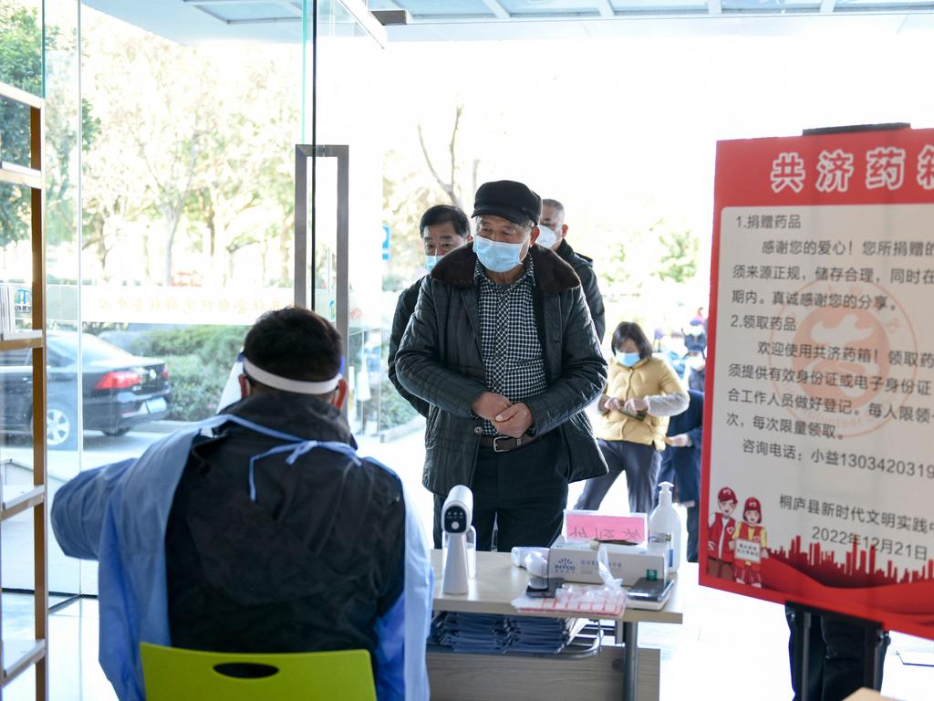 People register to collect medicine donated by merchants and residents at a public service centre in Tonglu, in China's eastern Zhejiang province. Picture: AFP / China OUT