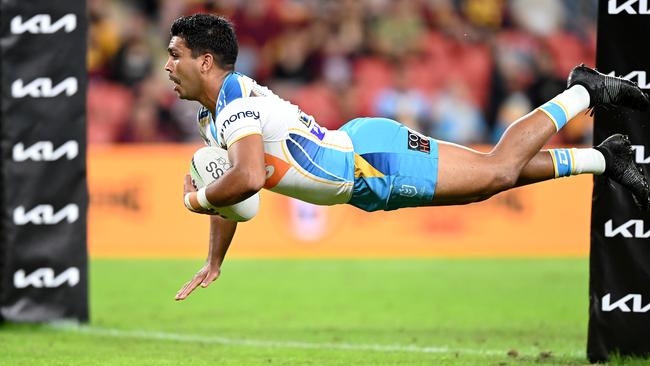 BRISBANE, AUSTRALIA - APRIL 30: Tyrone Peachey of the Titans dives over for a try during the round 8 NRL match between the Brisbane Broncos and the Gold Coast Titans at Suncorp Stadium, on April 30, 2021, in Brisbane, Australia. (Photo by Bradley Kanaris/Getty Images)