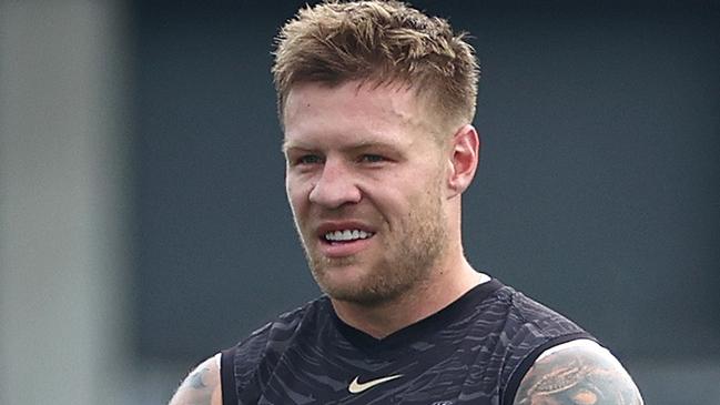 MELBOURNE, AUSTRALIA - MAY 10: Jordan De Goey, John Noble and Will Hoskin-Elliott of the Magpies look on during a Collingwood Magpies AFL training session at  on May 10, 2024 in Melbourne, Australia. (Photo by Quinn Rooney/Getty Images)