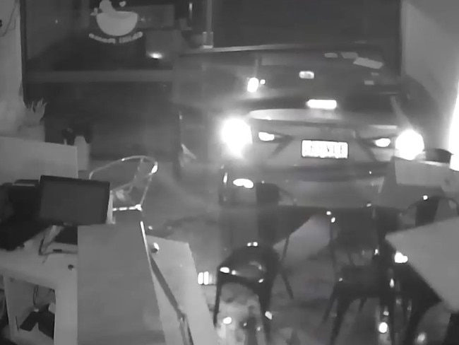 A stolen Mazda 3 reverses into the front of Chilli Mama Take Away in Whitfield on Monday night. Picture: Supplied