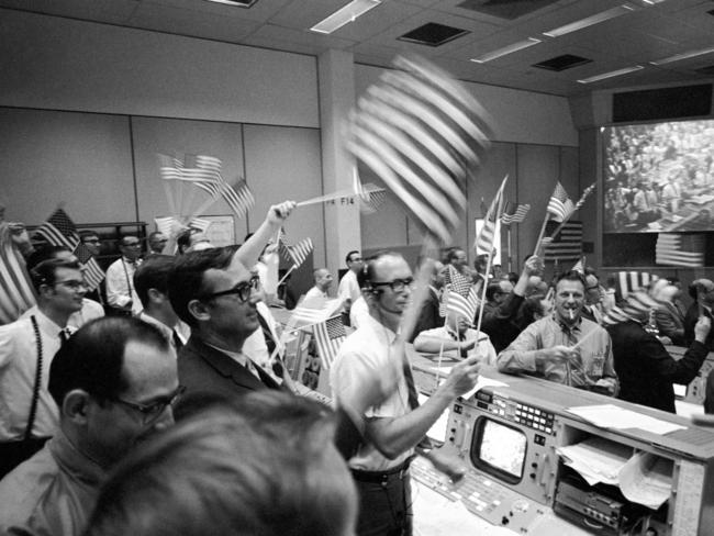 One small step. In this July 24, 1969 photo made available by NASA, flight controllers at the Mission Operations Control Room in Houston celebrate the successful conclusion of the Apollo 11 lunar landing mission. Picture: NASA via AP