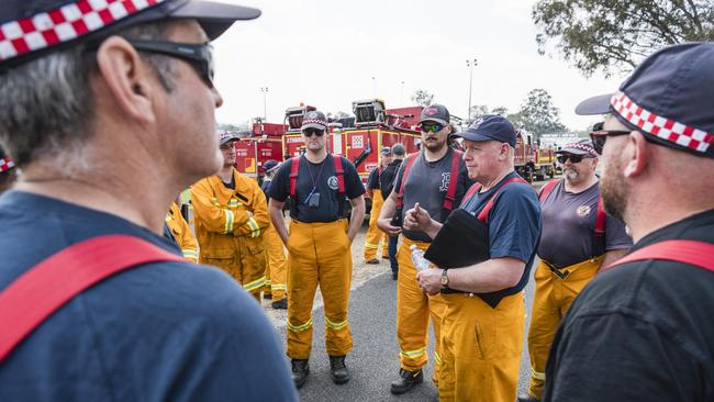 CFA strike team leader Tony McMeel of Freshwater Creek brigade talks to the team as CFA crews from Victoria arrive in Warwick to help support Queensland fireys, Thursday, November 2, 2023. Picture: Kevin Farmer