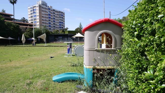 Furniture, umbrellas, old play equipment and ashtrays are all still scattered around the site.