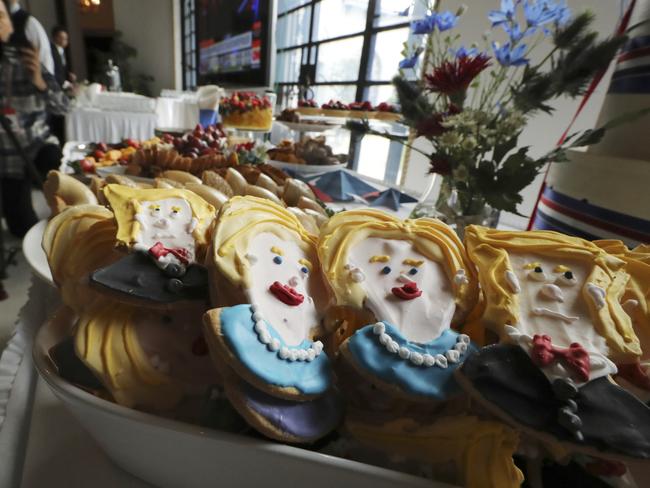 Cookies depicting Democratic presidential nominee Hillary Clinton and Republican presidential nominee Donald Trump are prepared prior to a live broadcasting of the 2016 U.S. Presidential Election results at U.S. Ambassador's residence in Tokyo, Wednesday, Nov. 9, 2016. (AP Photo/Eugene Hoshiko)