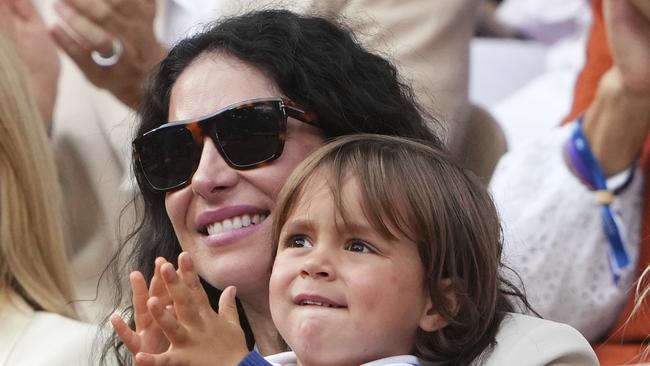 Rafa Nadal's wife, Maria Francisca Perello, holds her son Rafael Junior, during a farewell ceremony at centre court Philippe-Chatrier. (AP Photo/Lindsey Wasson)