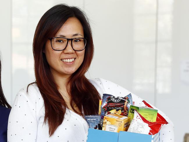 WEEKEND TELEGRAPH 11/8/20MUST NOT USE BEFORE CLEARING WITH ST PIC ED JEFF DARMANIN.Priscilla Liem (right) from Our Lady of the Rosary Parish in Fairfield has helped support nearly 50 families in the area during the pandemic by packing food hampers. Pictured with volunteer Julie Nguyen (left).  Picture: Sam Ruttyn