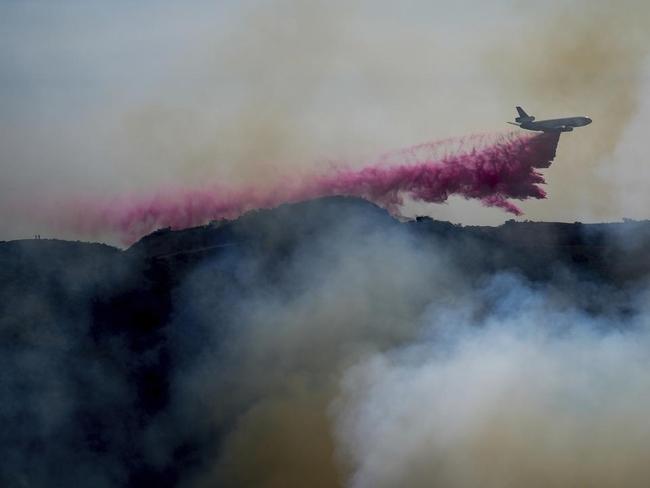 Brief weather respite: Firefighters make headway in battle to contain blazes