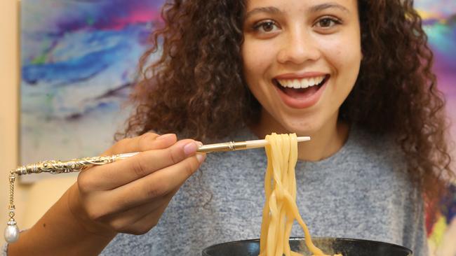 McKenna Lea from Mudgeeraba cant believe she is eating her noodle soup with the expensive chopsticks. Picture Glenn Hampson