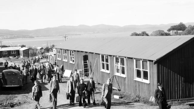 Blast from the Past column: Physics classes in temporary facilities as the University of Tasmania began its move to Sandy Bay in 1946. First-year students making their way to the original army hut classrooms.