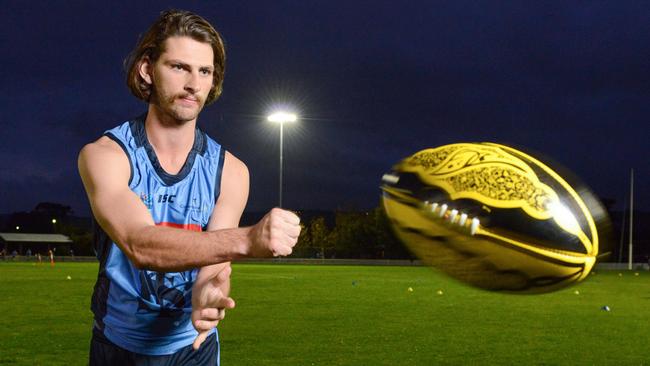 Sturt player Josh Patullo with a multicultural football to be used for the game against Central District at Unley Oval. Picture: Brenton Edwards