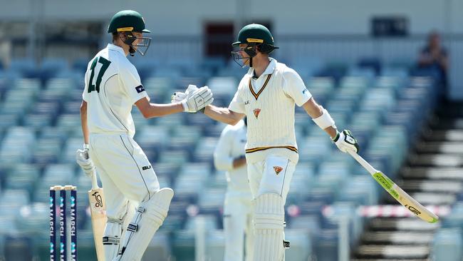 Tim Paine is congratulated by Tasmanian teammate Lawrence Neil-Smith after ending his century drought. Picture; AAP