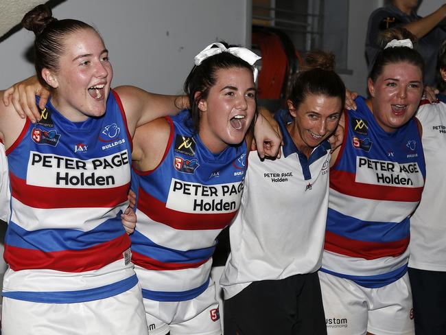 Central District women's players (from left) Katelyn Rosenzweig,Courtney Jensen and Jayme-Lee Sonneman sing the team song after defeatingWoodville-West Torrens in SANFLW on Friday, March 1 2019. Credit: DebCurtis.