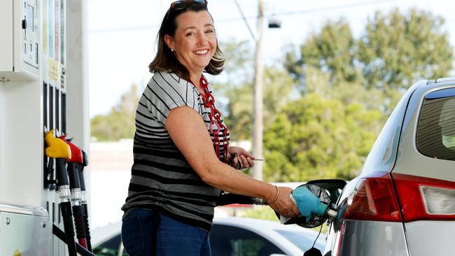 Amanda Money fills up with petrol at Metro Petroleum in Forestville where E10 was 91.9 cents per litre on Wednesday. Fuel prices are expected to drop to the lowest in 16 years. Picture: Jonathan Ng