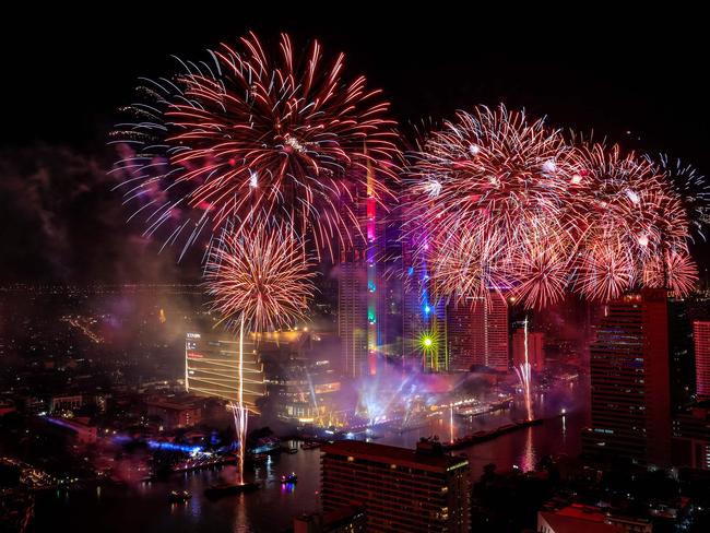 Fireworks explode over the Chao Phraya River during New Year celebrations in Bangkok at the start of January 1, 2019. Picture: AFP