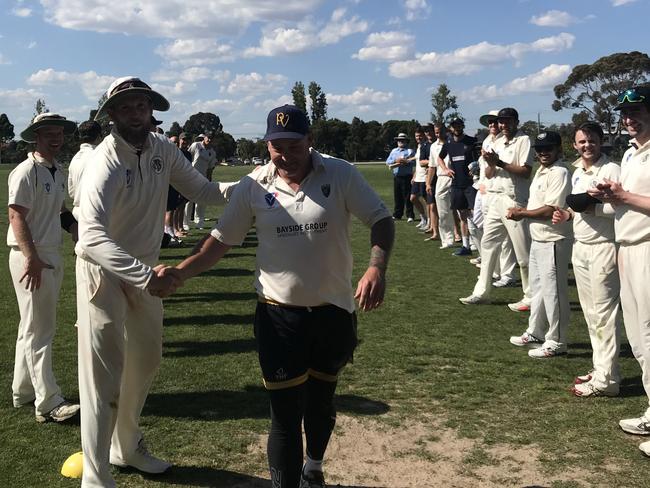 Sean Ayres was given a guard of honour by Plenty Valley and Brunswick after his 300th game. Picture: Greg Heatley.