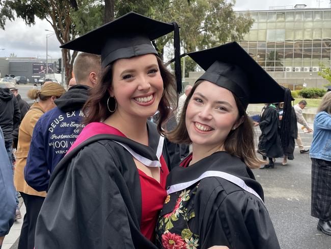 Emily Burnnett and Lilian Hudson outside Ballarat’s Civic Hall following their graduation ceremony.