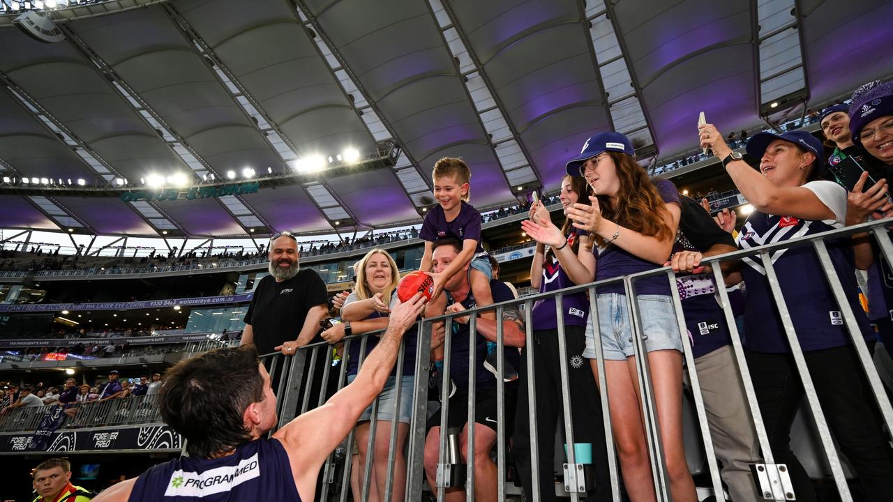 Andrew Brayshaw of the Dockers celebrates the win with the fans during the 2023 AFL Round 03 match between the Fremantle Dockers and the West Coast Eagles at Optus Stadium on April 2, 2023 in Perth, Australia. (Photo by Daniel Carson/AFL Photos via Getty Images)