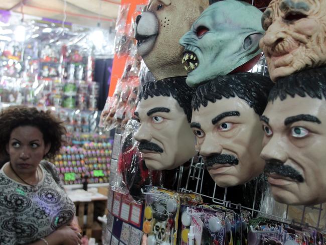 They’re all the same: Masks of famous Mexican drug trafficker currently on the run in a costume shop of central Mexico City. Picture: AAP Image/NEWZULU/IRVING CABRERA TORRES