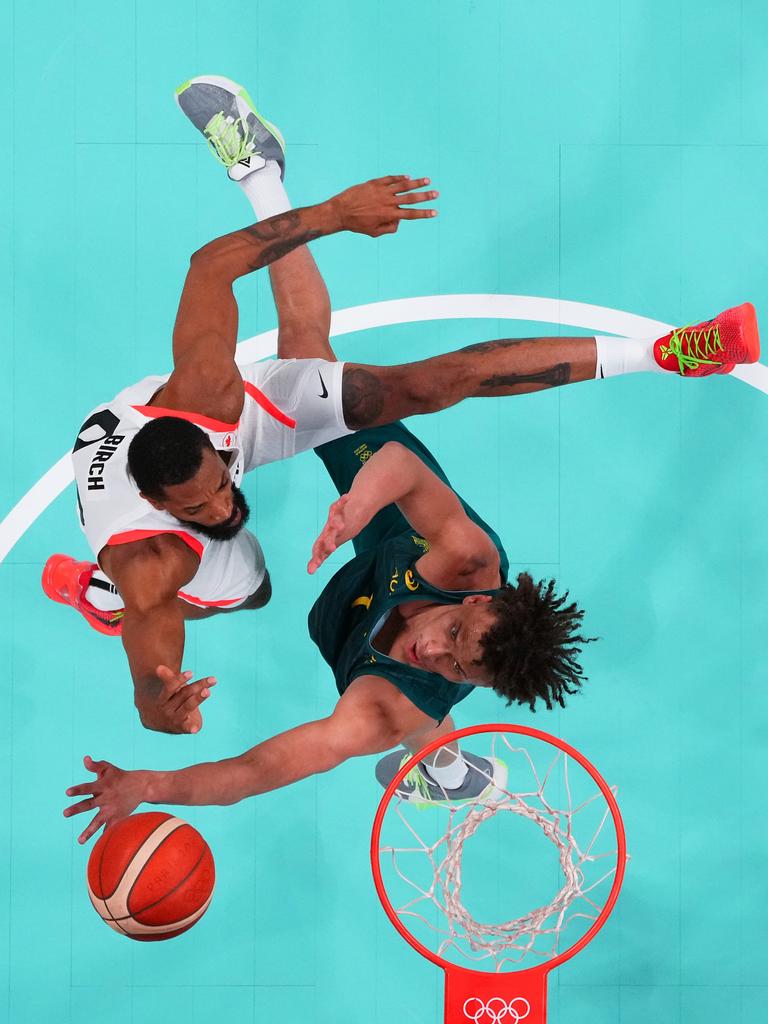 Captured using a robotic camera positioned above the field of play, Khem Birch, #92 of Team Canada, and Dyson Daniels, #1 of Team Australia, compete for the rebound during the men's group A match that did not end well for the Aussies. Picture: Pool/Getty Images