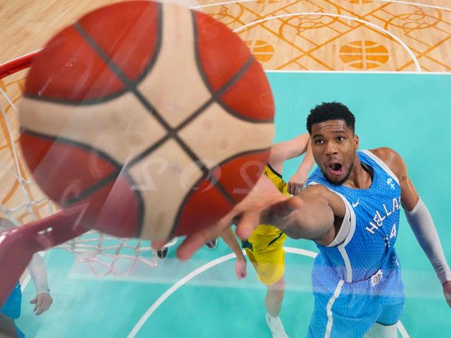 Giannis Antetokounmpo lays up the ball against the Boomers. Picture: Mark Terrill/Pool/AFP