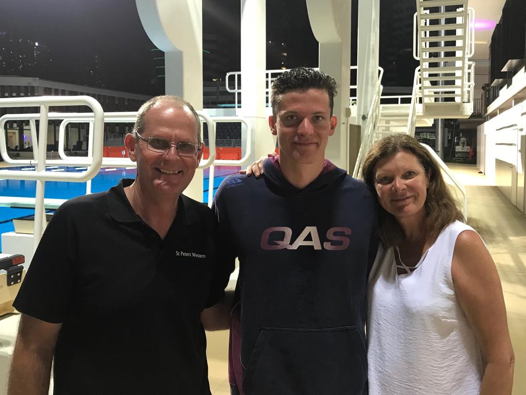 Jack Cartwright flanked by proud parents Brad and Michelle.