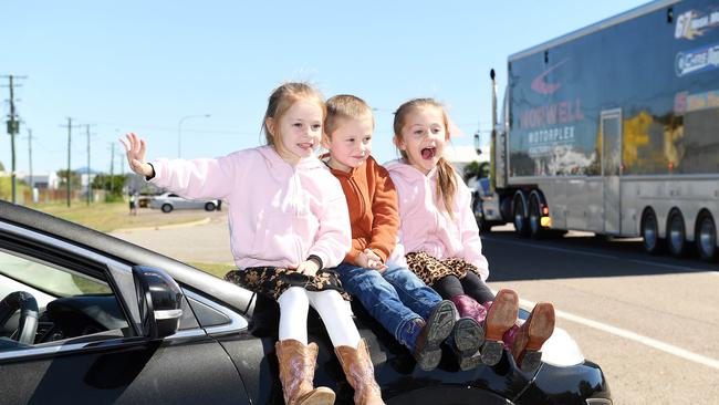 Aria, 6, Brendon, 5, and Amaya, 5, Mackinnon, from Mt Low watch The Transporter Parade in Townsville. Picture: Shae Beplate.