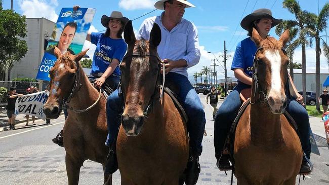 MP Jason Costigan riding down the main street of Proserpine being heckled by anti-Urannah Dam and anti-Adani protesters.