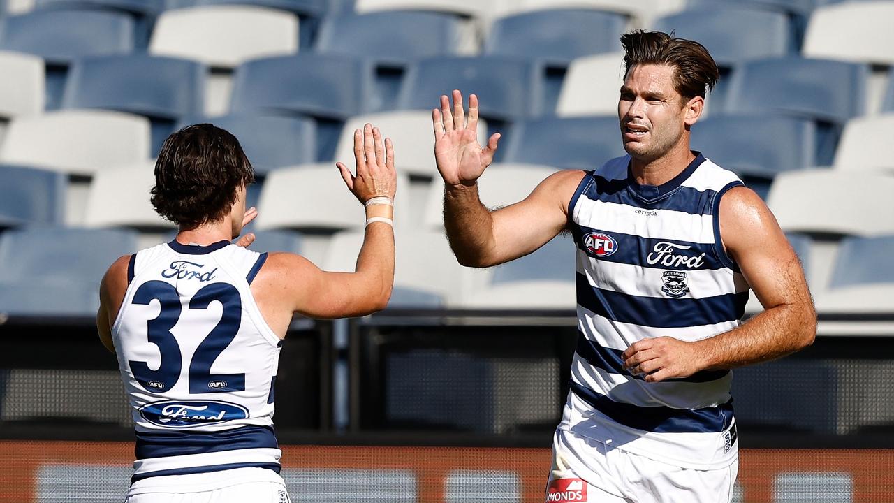 Gryan Miers celebrates a goal with Tom Hawkins against the Bombers. Picture: Michael Willson/AFL Photos via Getty Images