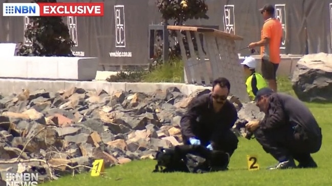 Federal police investigating cocaine haul inspect what appears to be diving equipment discovered on the shore of Newcastle Harbour near Honeysuckle Drive on January 25, 2023. Picture: NBN News.