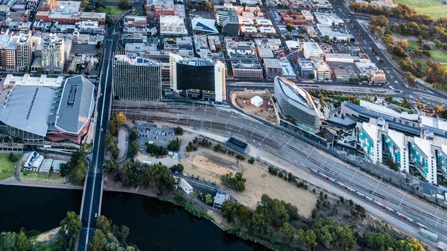 The new arena would be built on the bank of the Torrens River, just west of Morphett St and the Convention Centre and north of the biomedical precinct. Picture: Adelaide Airborne Photography