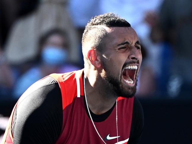 MELBOURNE, AUSTRALIA - JANUARY 25: Nick Kyrgios of Australia reacts in his Men's Doubles Quarterfinals match with Thanasi Kokkinakis of Australia against Tim Puetz of Germany and Michael Venus of New Zealand during day nine of the 2022 Australian Open at Melbourne Park on January 25, 2022 in Melbourne, Australia. (Photo by Quinn Rooney/Getty Images)