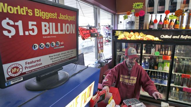 Steve Poulin sells Powerball tickets at the Sunnybrook Tavern and Liquor Store on January 13, 2016 in Fort Washington.