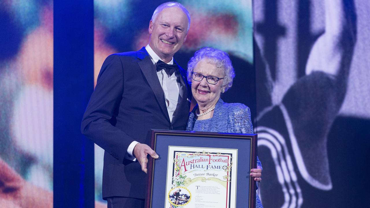 Norma Barker, mother of the late Trevor Barker, accepts Trevor's induction during the 2019 Australian Football Hall Of Fame Induction Dinner.