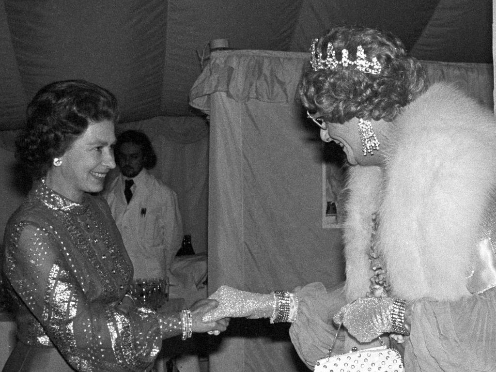 Queen Elizabeth II meets Dame Edna Everage in 1977 at the Queen's Silver Jubilee Appeal. (Photo by PA Images via Getty Images)