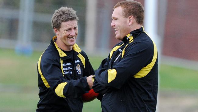 Damien Hardwick has a laugh with Justin Leppitsch.