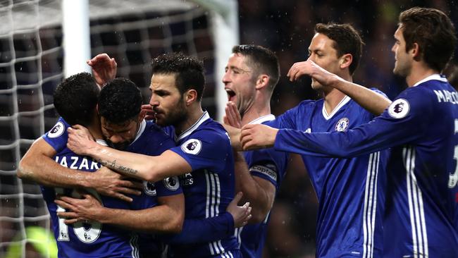 Diego Costa of Chelsea (C) celebrates scoring.