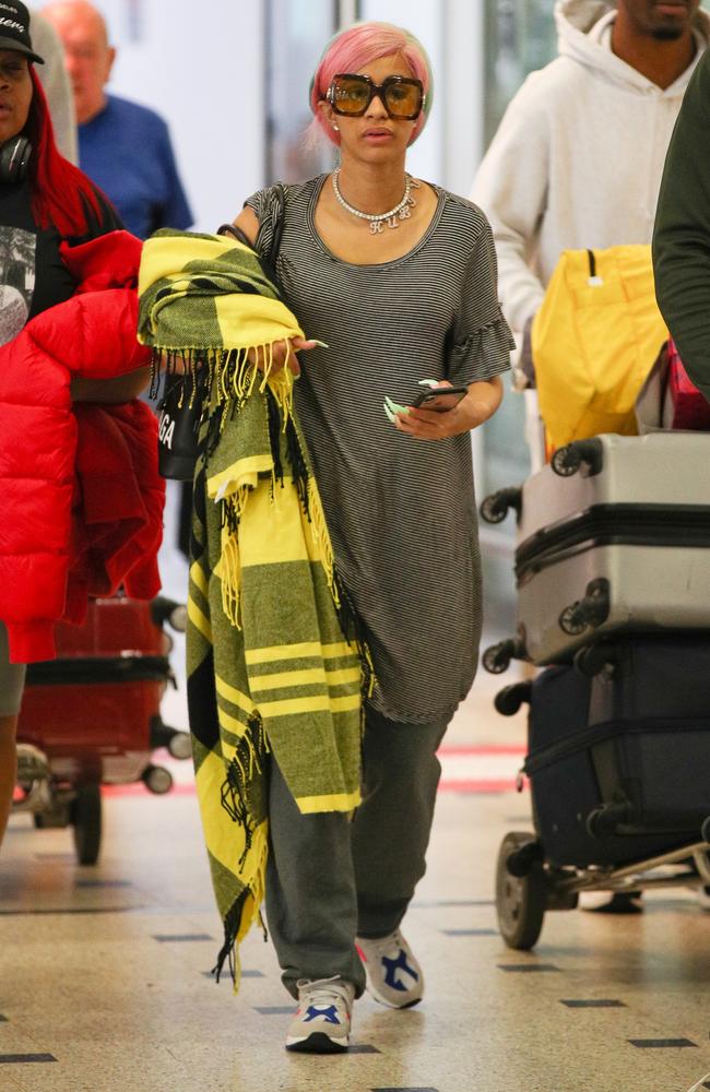 Cardi was in no mood to greet her fans after she was seen walking through the airport dressed more like someone’s gran. Picture: Matrix