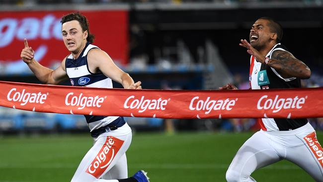 Jordan Clark takes out the quarter-time sprint over Brad Hill.