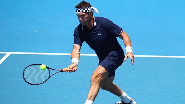 MELBOURNE, AUSTRALIA — JANUARY 22: Pat Cash of Australia plays a forehand in his legend's match with Mark Woodforde of Australia against Fabrice Santoro of France and Mansour Bahrami of France on day eight of the 2018 Australian Open at Melbourne Park on January 22, 2018 in Melbourne, Australia. (Photo by Mark Kolbe/Getty Images)