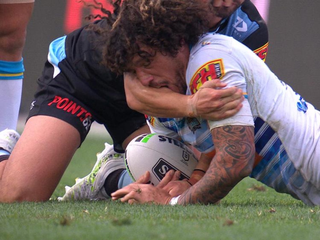 Kevin Proctor bites the arm of Shaun Johnson.